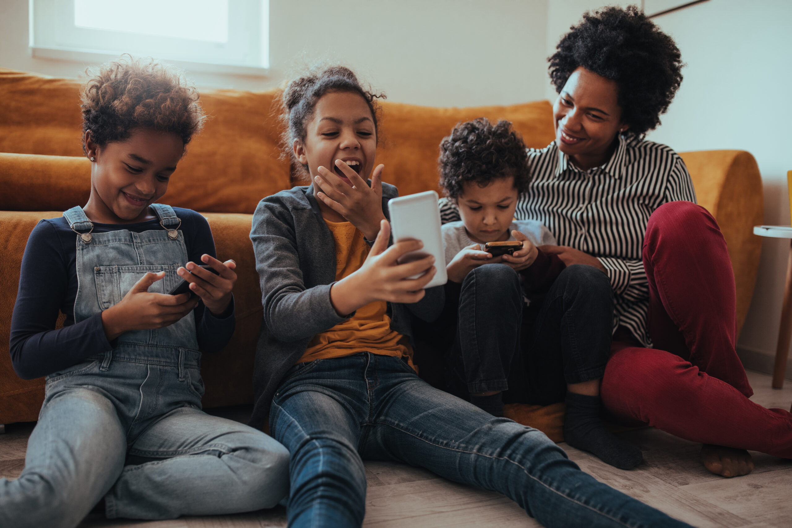 Portrait of a smiling mother enjoying time with her children