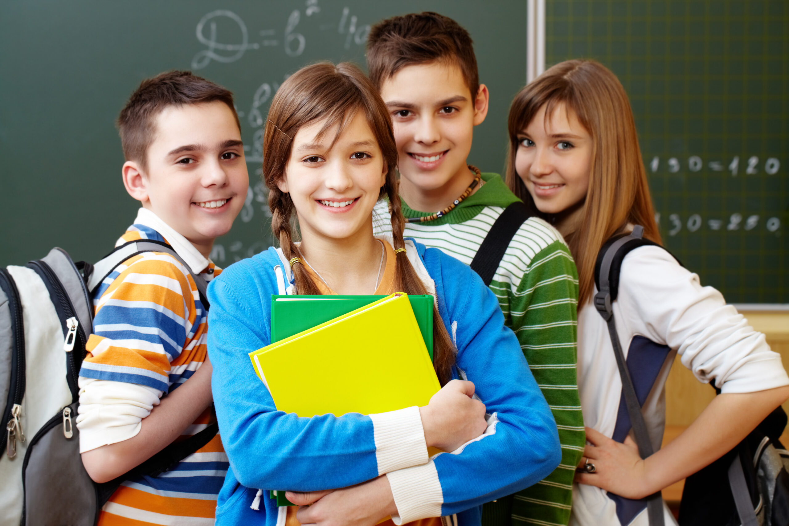 Portrait of happy teens looking at camera with smiles